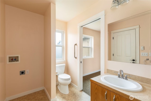 840 Beckett Point Rd, Port Townsend, WA 98368 - half bath featuring vanity, baseboards, and toilet