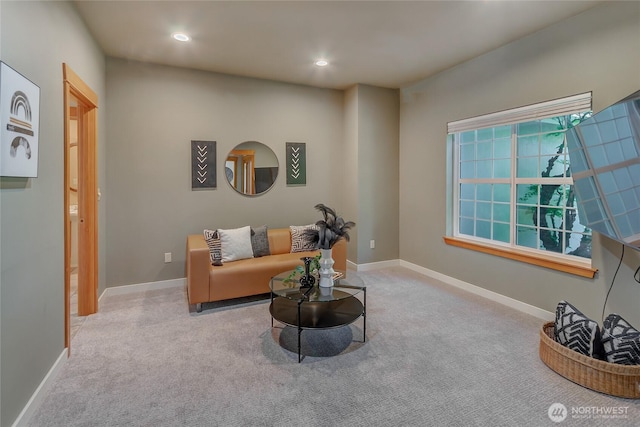 living area with recessed lighting, plenty of natural light, and carpet