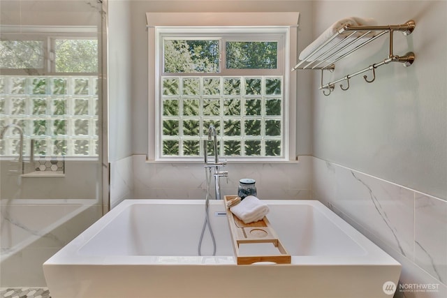 bathroom featuring a sink and a bathtub
