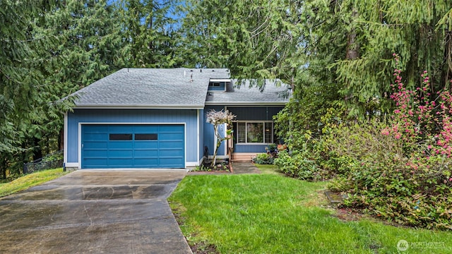 2336 Killarney Ct NW, Olympia, WA 98502 - view of front of home featuring a garage, a shingled roof, a front lawn, and driveway