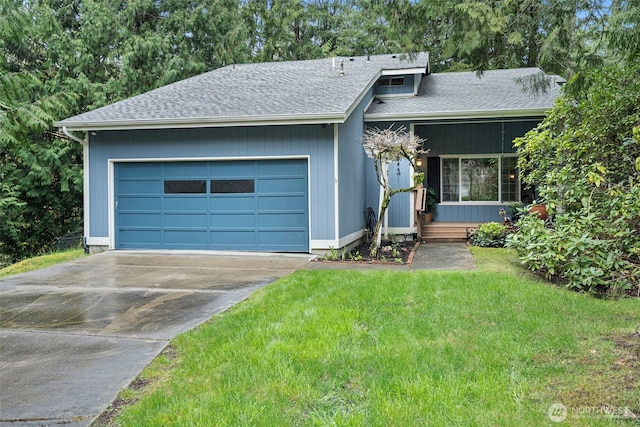 2336 Killarney Ct NW, Olympia, WA 98502 - view of front of home with roof with shingles, concrete driveway, an attached garage, and a front lawn