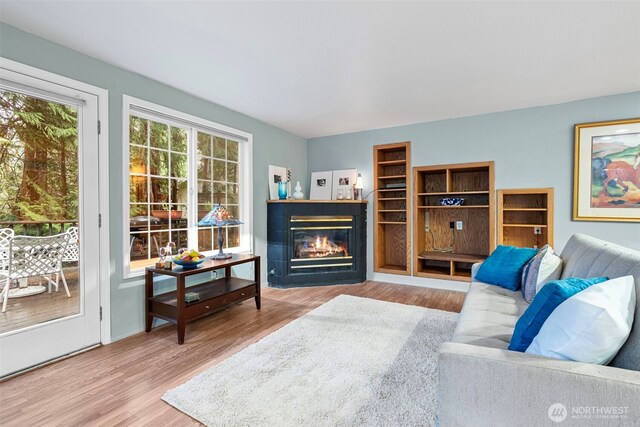 2336 Killarney Ct NW, Olympia, WA 98502 - living room featuring a tiled fireplace and wood finished floors