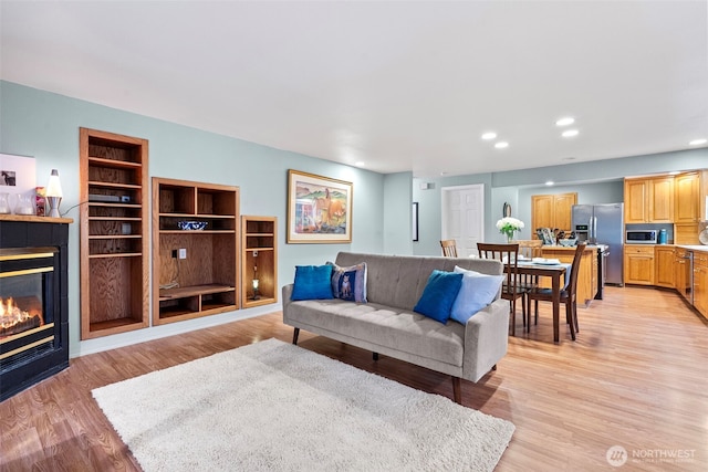 2336 Killarney Ct NW, Olympia, WA 98502 - living area with light wood-style floors, a fireplace, and recessed lighting