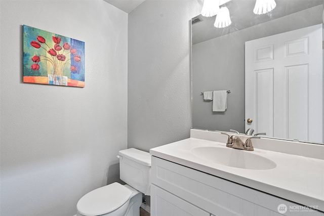 2336 Killarney Ct NW, Olympia, WA 98502 - bathroom with toilet, vanity, and visible vents
