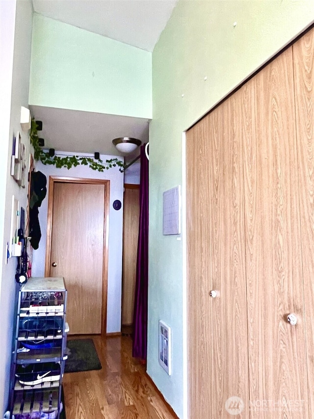 corridor featuring wood finished floors