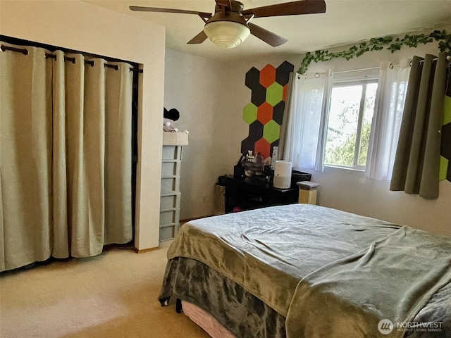 bedroom with light carpet and ceiling fan
