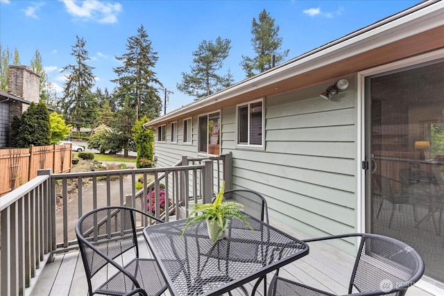 deck featuring outdoor dining area