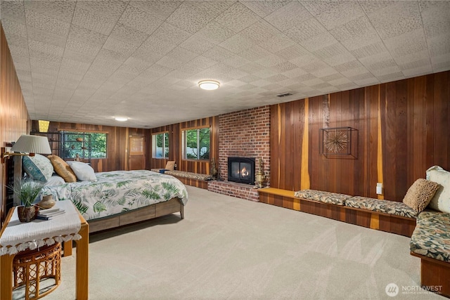 2139 SW 316th St, Federal Way, WA 98023 - bedroom featuring carpet flooring, wooden walls, and a fireplace