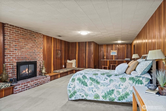 2139 SW 316th St, Federal Way, WA 98023 - bedroom featuring wooden walls, visible vents, a brick fireplace, and carpet