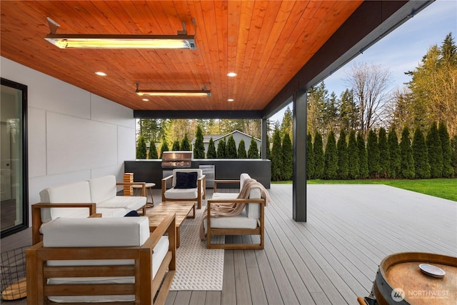 deck with grilling area, outdoor lounge area, and an outdoor kitchen
