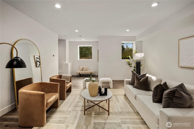 living area with recessed lighting, baseboards, and wood finished floors