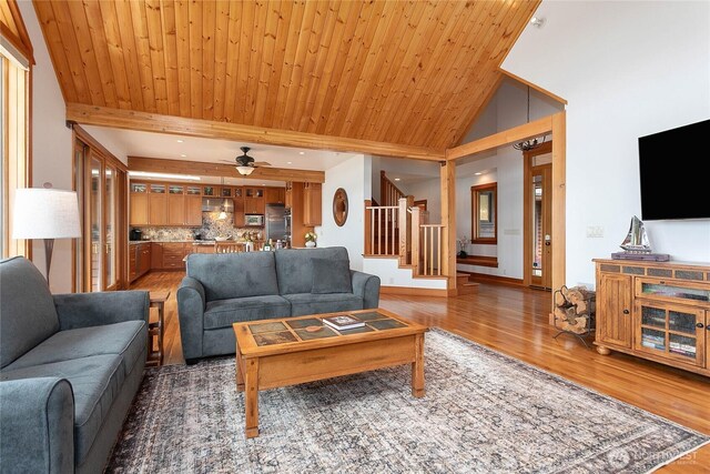 3193 Northshore Rd, Bellingham, WA 98226 - living room featuring a ceiling fan, stairs, light wood finished floors, and vaulted ceiling