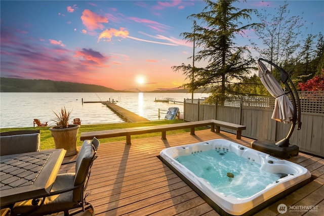3193 Northshore Rd, Bellingham, WA 98226 - deck at dusk featuring hot tub deck surround, a water view, and a boat dock