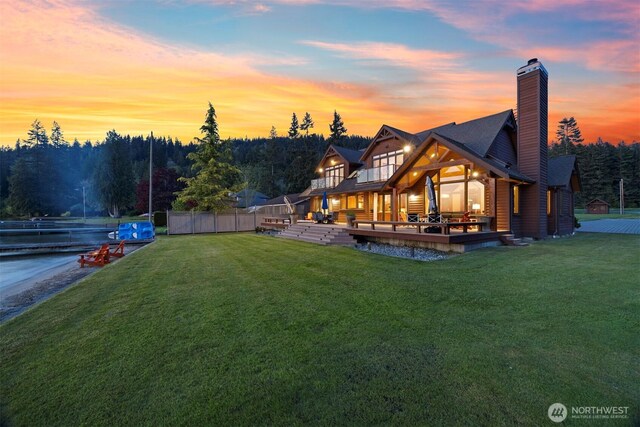 3193 Northshore Rd, Bellingham, WA 98226 - exterior space featuring a lawn, fence, a chimney, and a deck with water view