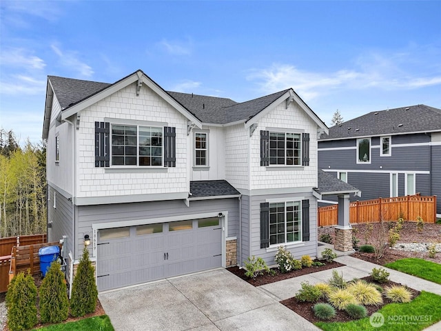 18619 128th St E, Bonney Lake, WA 98391 - view of front of house featuring a garage, driveway, a shingled roof, and stone siding