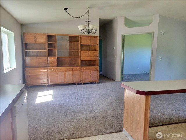 unfurnished dining area with a notable chandelier and light colored carpet