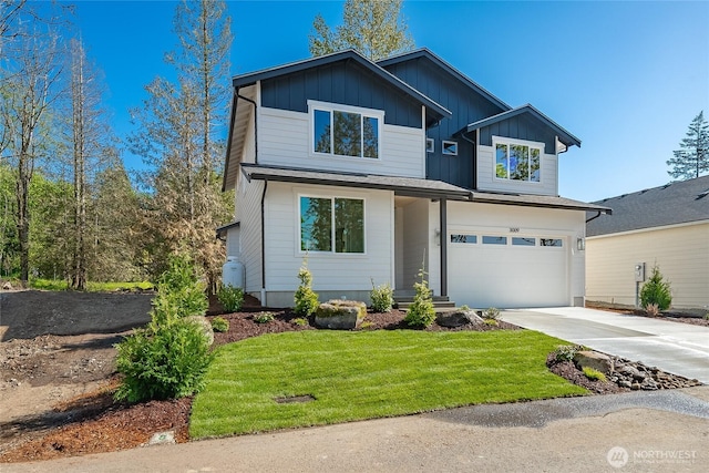 3009 Oleander Ln, Blaine, WA 98230 - view of front of house with board and batten siding, driveway, a front lawn, and a garage