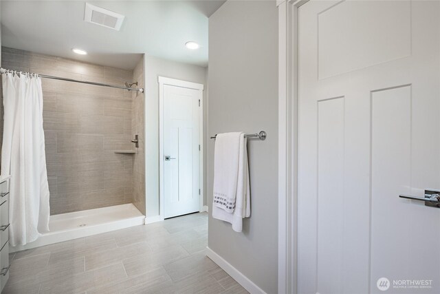 3009 Oleander Ln, Blaine, WA 98230 - full bath featuring recessed lighting, baseboards, visible vents, and a tile shower