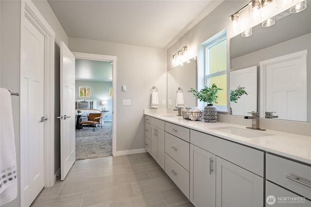 3009 Oleander Ln, Blaine, WA 98230 - ensuite bathroom with double vanity, a sink, baseboards, and a wealth of natural light