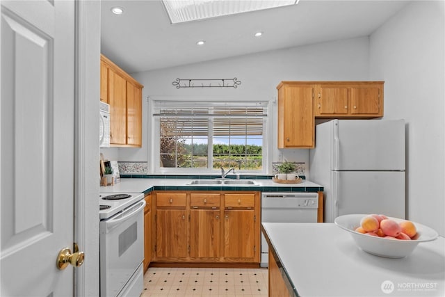 kitchen featuring a sink, recessed lighting, white appliances, and lofted ceiling
