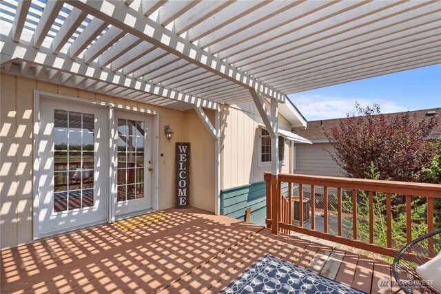 wooden terrace featuring a pergola