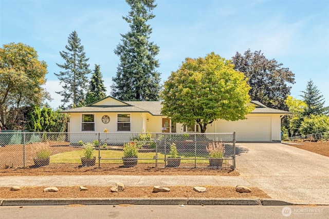 2607 SE 138th Loop, Vancouver, WA 98683 - ranch-style home featuring concrete driveway, a garage, and a fenced front yard