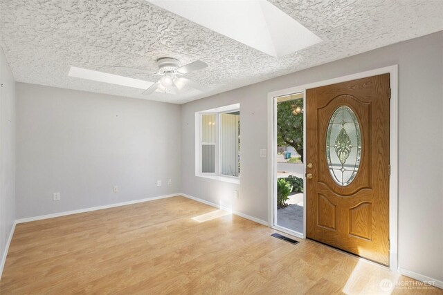 2607 SE 138th Loop, Vancouver, WA 98683 - foyer with a skylight, light wood-style flooring, a textured ceiling, and a ceiling fan
