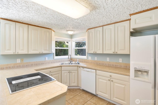 2607 SE 138th Loop, Vancouver, WA 98683 - kitchen featuring white appliances, light tile patterned floors, and a textured ceiling