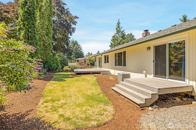 2607 SE 138th Loop, Vancouver, WA 98683 - view of grassy yard with a wooden deck