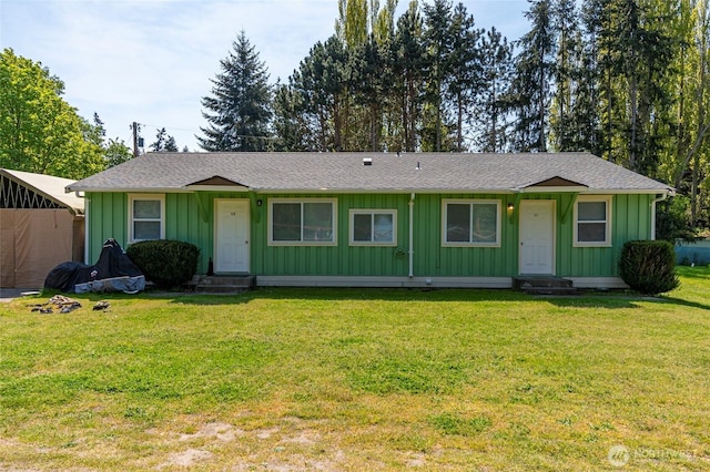 single story home with entry steps, board and batten siding, and a shingled roof