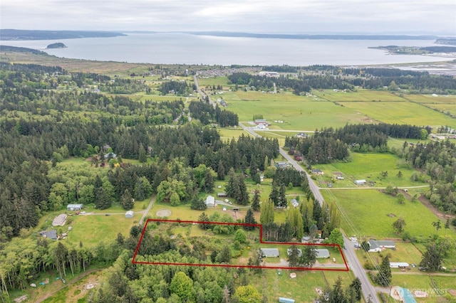 aerial view with a water view and a rural view
