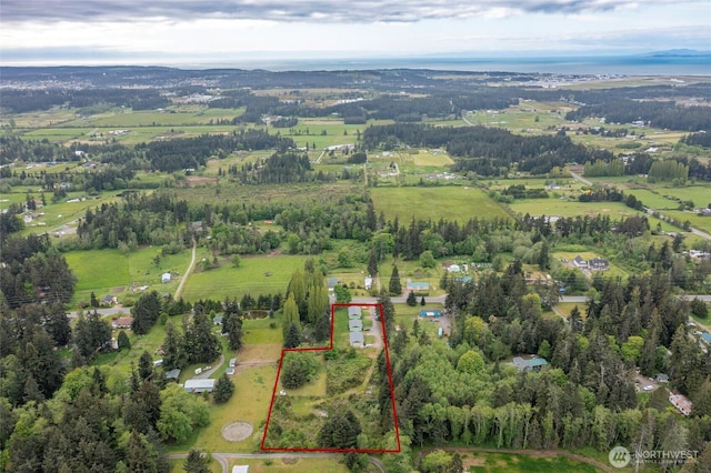 birds eye view of property featuring a rural view