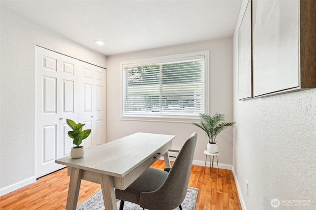 office with light wood finished floors and baseboards
