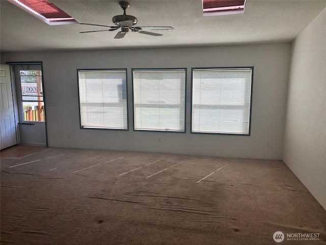 unfurnished room featuring carpet floors and ceiling fan