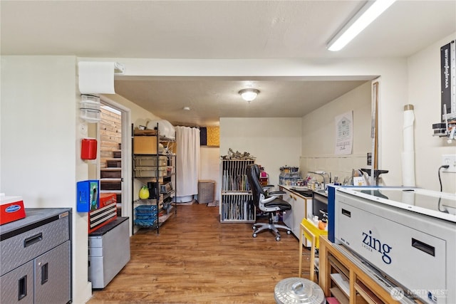home office with light wood finished floors