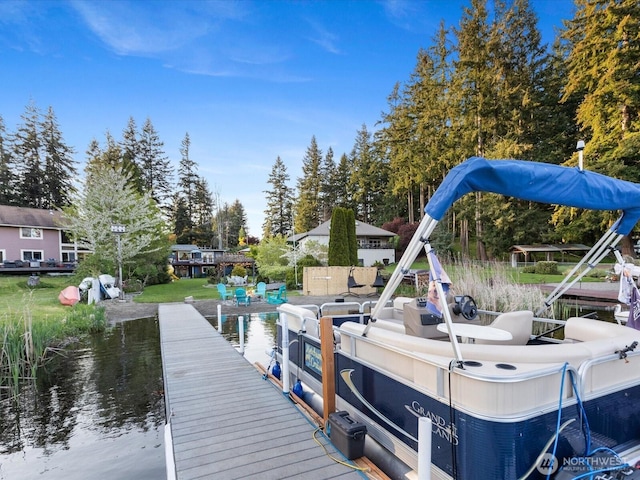 dock area featuring view of wooded area