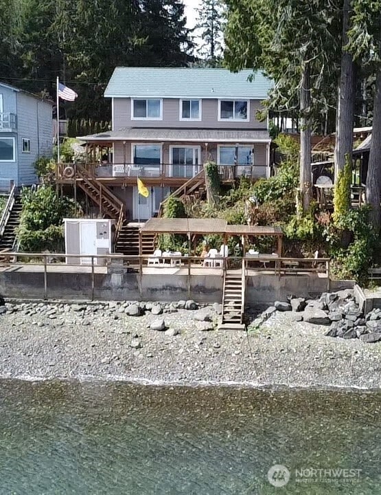 rear view of property with stairway