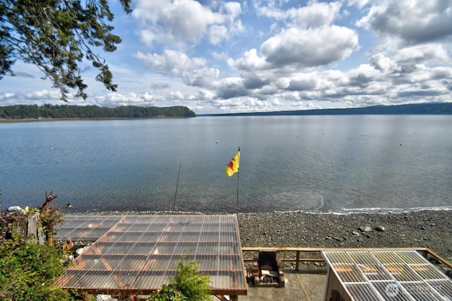 property view of water featuring an exterior structure