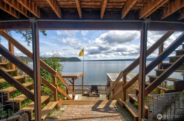 view of dock with stairway and a water view