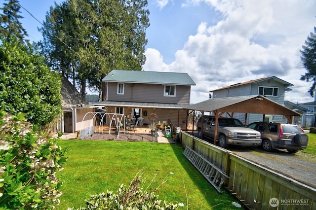 rear view of property with a yard