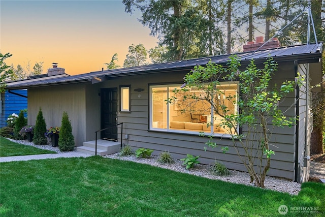 19010 12th Ave NE, Shoreline, WA 98155 - view of front of house with a chimney and a yard