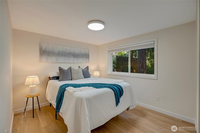 19010 12th Ave NE, Shoreline, WA 98155 - bedroom featuring baseboards and wood finished floors