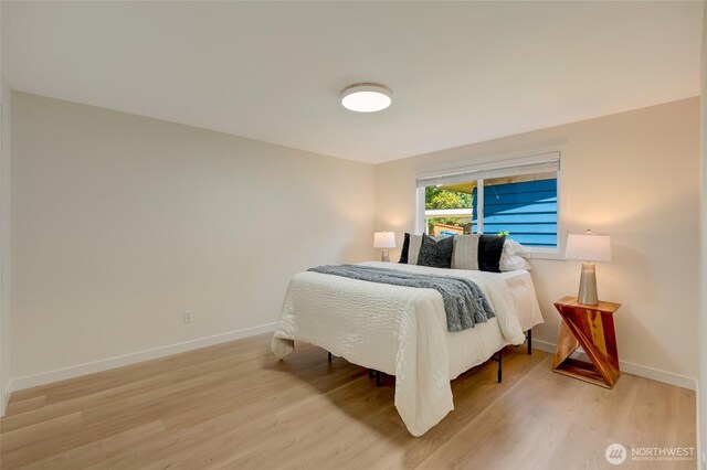 19010 12th Ave NE, Shoreline, WA 98155 - bedroom featuring light wood-style flooring and baseboards
