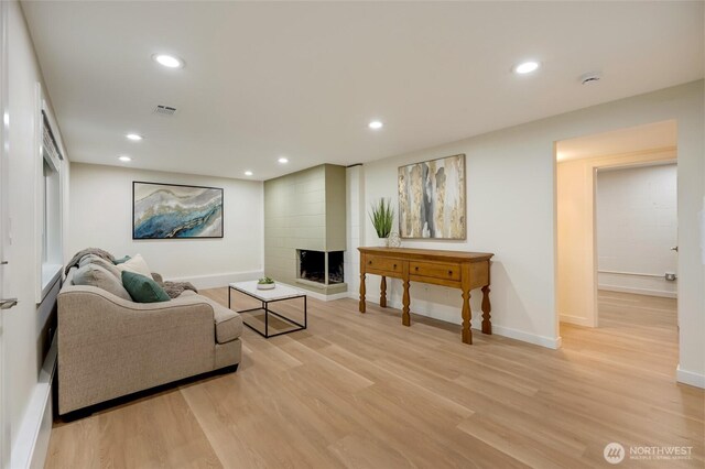 19010 12th Ave NE, Shoreline, WA 98155 - living area with a fireplace, light wood-type flooring, and recessed lighting