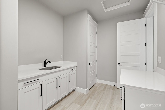 1436 238th St SE, Bothell, WA 98021 - washroom featuring baseboards, a sink, and attic access
