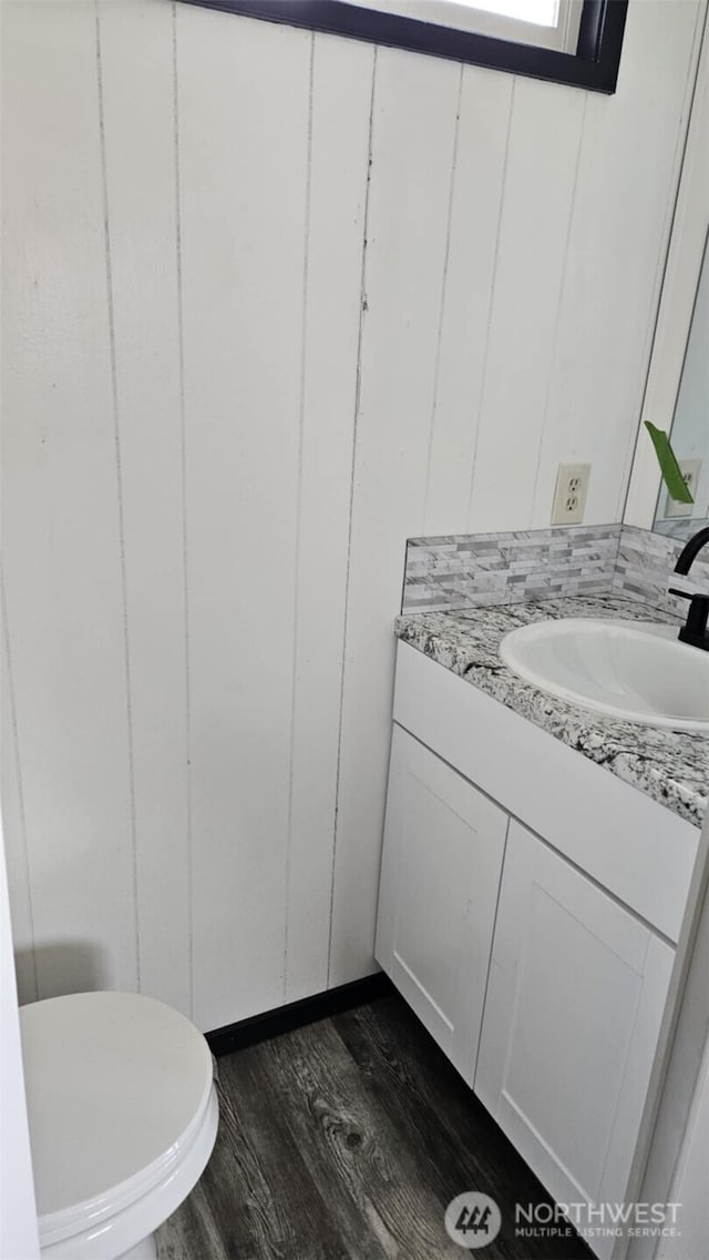 411 W Grove St Unit B, Shelton, WA 98584 - bathroom with wood finished floors, vanity, and toilet