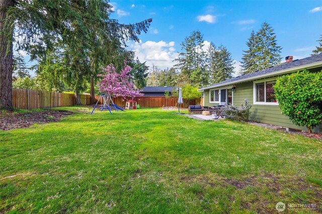 view of yard featuring a fenced backyard and a patio