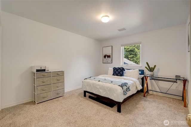 bedroom with light carpet, baseboards, and visible vents