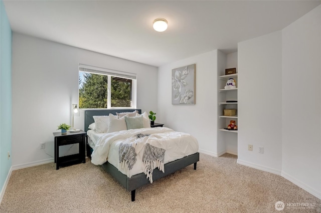 bedroom featuring baseboards and carpet floors