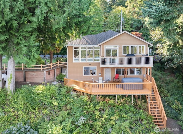 14407 Goodrich Dr NW, Gig Harbor, WA 98329 - back of property featuring stairs, a deck, fence, and a shingled roof